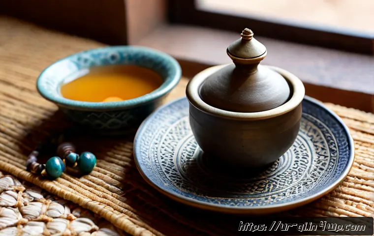 Home 14 명상적 여행의 기념품 선택 - Photorealistic close-up of a mindful travel souvenir selection on a handwoven Pakistani ajrak cloth:...